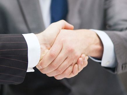 Residential Closings with a handshake at Priority Title, LLC